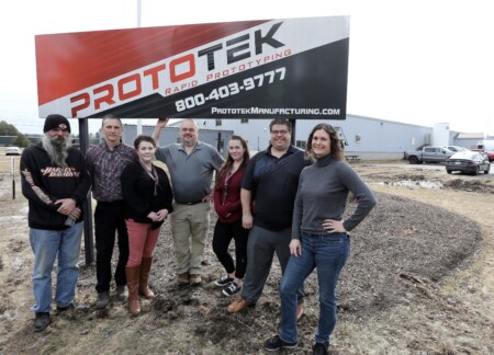 Prototek Team With Sign